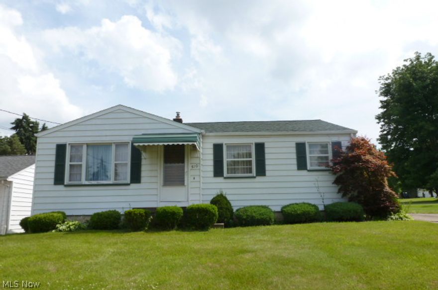 Attractive three bedroom ranch with a spacious kitchen, hardwood floors, full basement, and double detached garage.