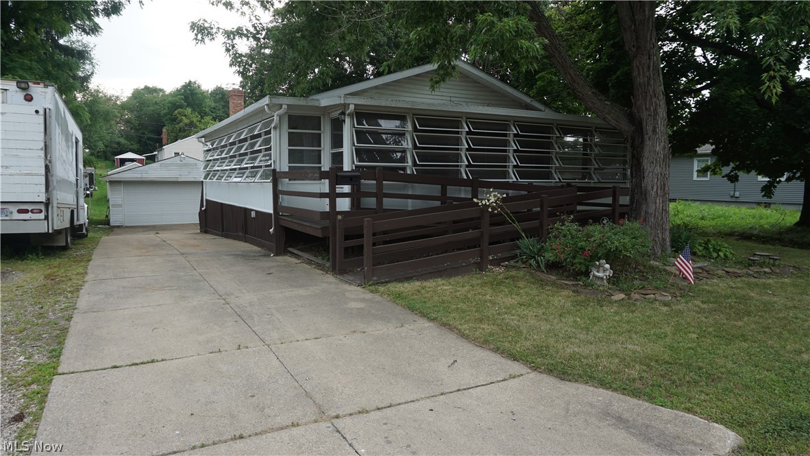 This 3-bedroom, 2-full bath ranch boasts a large, wrap-around enclosed porch that allows lots of space and sunlight; complete with a handicap accessible ramp. This house also features spacious bedrooms and a first-floor laundry hook-up – no need to haul clothes up and down stairs. The stone wood-burning stove, spacious family room, and outside access in the basement makes it a great gathering place. The property also has a 2-car garage. This one comes with America's Preferred Home Warranty! All new carpet on the main floor! Call today to schedule your private tour!