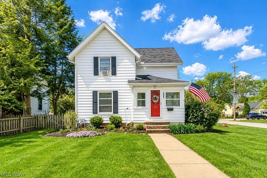 Welcome to 4516 Wood Street, a truly exceptional traditional colonial nestled in the heart of downtown Willoughby, where timeless character meets thoughtful modern updates in one of the area’s most desirable and walkable neighborhoods. Perfectly positioned just minutes from vibrant downtown shops, dining, and entertainment, this stunning four bedroom, two full bathroom residence offers both charm and convenience with a highly functional layout that includes a rare first floor bedroom and full bath. From the moment you arrive, the home’s classic curb appeal is enhanced by mature landscaping, a beautifully maintained yard, and a welcoming front entry, while an oversized two car garage and inviting outdoor picnic area provide ideal spaces for relaxation and gatherings. Inside, the home showcases beautiful hardwood flooring throughout the kitchen and formal dining room, creating warmth and continuity, while the updated kitchen is thoughtfully designed with newer cabinetry, granite countertops, ceramic backsplash, modern fixtures, a built-in pantry, and a dedicated eat-in area complete with a convenient desk space. Classic traditional windows in the kitchen add charm and ambiance, while the remainder of the home benefits from vinyl replacement windows that enhance efficiency and comfort. The spacious dining room is perfect for entertaining and the cozy front living room features an oversized picture window offering picturesque neighborhood views. The main level is further enhanced by a full bathroom with ceramic flooring and a versatile first floor bedroom ideal for guests or flexible living. Upstairs, three generously sized bedrooms are complemented by a second full bathroom with updated vinyl plank flooring, along with a bonus finished loft area that provides additional storage and closet space. With updated kitchen and baths and an unbeatable location, this home offers a rare opportunity to enjoy classic living with modern comfort in an exceptional downtown setting.