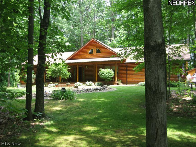 MOTIVATED SELLER - Nestled in the woods - Impressive log home sits on 1.71 acres. Enjoy the relaxing front porch (40 x 8), back to nature. Inside a large great room welcomes you, unbelievable cathedral ceiling. Kitchen includes stainless appliances, dining area, living area & gas fireplace. 1st floor master bedroom & full bath with jetted soaking tub. 2 extra bedrooms, one being used as an office/craft room, 1st floor laundry & full main bath. Basement can be customized to your liking. Extra-large garage can accommodate 3 cars. Security system,"Rinna (hot Water) Instantance" plus A O Smith hot water tank for back up & water softener. Public sewers. Adorable log play house, stamped patio (48 x 12) & log shed. This home has so much to offer if you are looking for a peaceful relaxing location. When the leaves are on the trees this home & setting is very private. HOME WARRANTY INCLUDED.