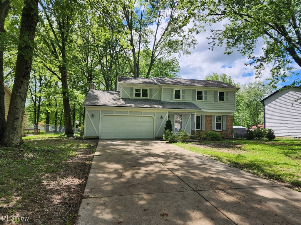 Welcome to this 4-bedroom, 2.5-bath Colonial in Sought-After Hitchcock Woods in the heart of Boardman with a fresh coat of paint! The main level features a bright 17x11 living room and a formal 11x10 dining room, both with stunning laminate flooring. The spacious eat-in kitchen is a chef’s delight with stainless steel appliances including a refrigerator, gas range with double oven, and dishwasher, all set atop a ceramic tile floor. From the kitchen, you can step outside to a massive 36x16 deck, perfect for entertaining or relaxing. The cozy family room offers ample space and a gas fireplace for those chilly evenings. Upstairs, enjoy brand-new carpeting throughout. The 14x13 primary suite includes a walk-in closet and a private bath. Three additional generously sized bedrooms with great closet space and a full hall bath complete the second floor. The 22x22 finished basement provides even more living space, along with a dedicated laundry/utility room. Other highlights include a brand new double garage door and plenty of storage throughout. Don’t miss your chance to own this move-in ready gem!