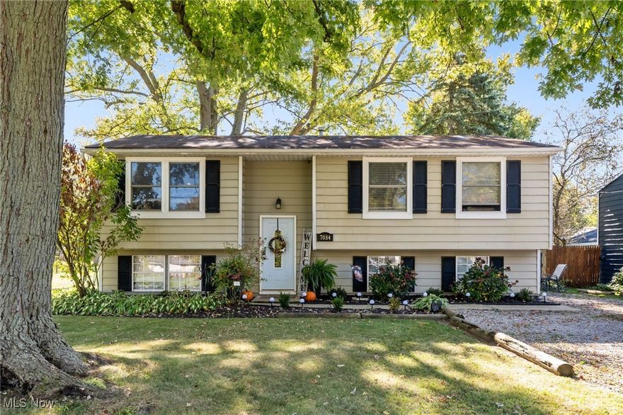 This beautifully re-imagined 4-bedroom, 2-bath home blends modern style with relaxed lakeside living on a spacious double lot just one block from Lake Erie. The chef’s kitchen features a dramatic stone island with sink, dishwasher, and breakfast bar—like having your own chef’s table. An open main-level lounge flows from the kitchen, perfect for everyday living and entertaining. The lower level adds a second large lounge ideal for a bar or home theater, plus a full bath with walk-in shower and laundry. The main bath offers a soaking tub for unwinding after enjoying the generous yard, which has room for a pole barn or large garage. A new winery a block away adds to the lifestyle appeal. Move-in ready, stylishly updated, and the seller will entertain any written offer. Seller is willing to contribute 3% to buyer's closing costs with acceptable offer.