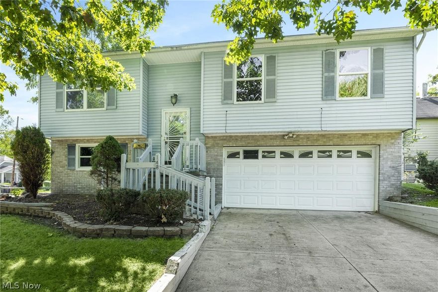 A great opportunity to own this move in ready charming bi-level located on a corner lot in Central Akron.  The property features new vinyl flooring throughout the living room, hallway, bedrooms, and lower level basement.  The updated kitchen caters to your inner chef with beautiful new countertops, microwave, range, refrigerator, and ample cabinet space.  The deck doors off of the dining area as well as the beautiful kitchen and living room windows, allow plenty of natural light to this entertaining area.  Down the hall you'll find a full bathroom and 3 nicely sized bedrooms with plenty of closet space.  The full finished basement, also perfect for entertaining, offers a half bath, updated laundry area, and space for storage.  The basement leads to the two car attached garage equipped with electric garage door opener.  The huge oversized deck that runs the whole length of the back of the house, is accessible from the the dining room as well as one of the back bedrooms, and has been per