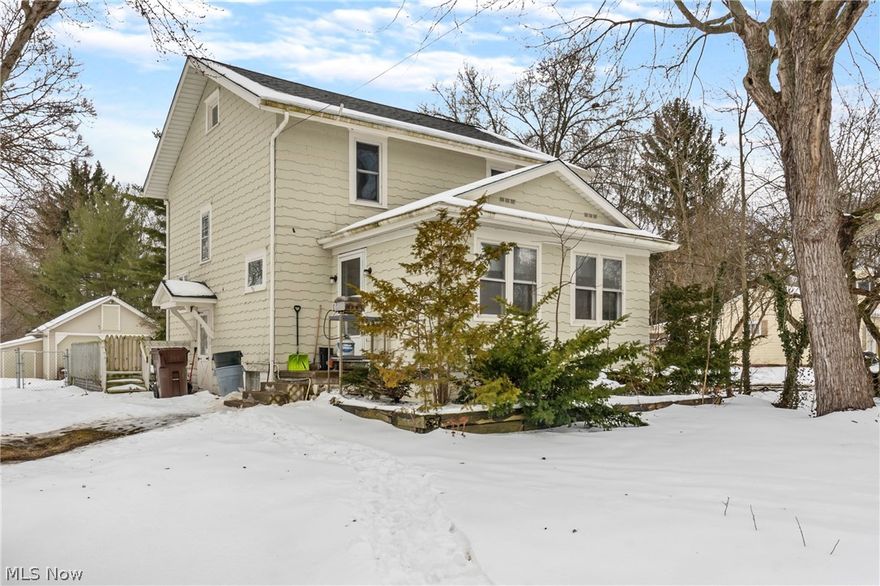 This 2 story home in East Canton is positioned on a large double lot with 1.45 acres of flat land! Throughout the home you will find, 3 bedrooms, 1 full bath, 2 half baths, and great modern updates throughout. The entire home features neutral decor and hardwood flooring that will match any decorating style. Cooking and entertaining will be easy in the spacious eat-in kitchen complete with an abundance of soft-close KraftMaid cabinets, newer appliances, recessed lighting, and laminate plank flooring. The first floor has 2 half baths, one of which you could easily add a commode to convert to a full bathroom. Take time to relax in the sunroom - the overhead cabinets make it a great space for an at-home office as well. Upstairs, all 3 bedrooms equipped with ceiling fans and a full bathroom with a single vanity and copper fixtures.  As a bonus, the outbuilding on the property has electricity and can be used as a workshop. This partially fenced, large piece of property won't last long. Don't