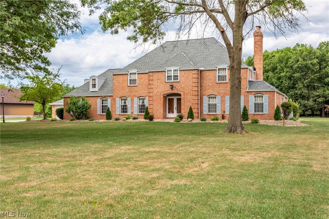 Impressive 3500+ SqFt brick colonial on 4.65 Acres! Motivated sellers! Home is priced below the tax value and is ready to move in. Located on Castleton Lane in Midview Schools, this 4 Bedroom 3.5 bath home has many updates and services already done. Brand new roof on the home and 3 car detached garage, many updates including the remodeled basement. The owners suite has a full bath with extra sink, walk-in closet and a separate area that could be used as an office, dressing area, or nursery. Eat-in kitchen and formal dining room that has new hardwood flooring. Plenty of room for entertainment in the living room with a gas fireplace, family room with a gas fireplace and great room.