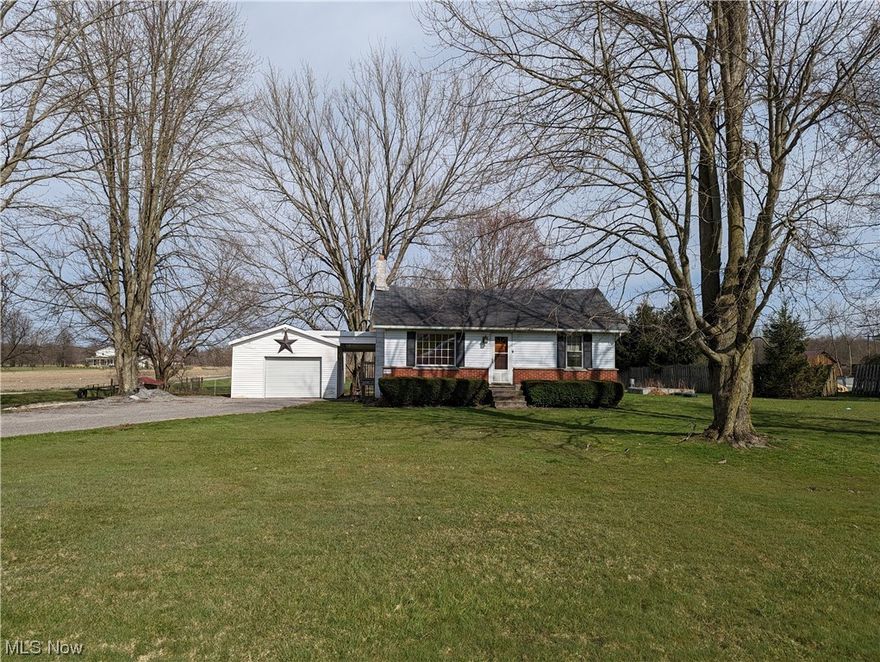 Country Living is HERE! This 1 acre parcel feels much bigger from being surrounded by large country properties. Enjoy the sounds of nature or the clippity-clop of the horse and buggies traveling infront of your Ranch home. There gravel drive offers pleny of room for you and your visitors. One can can go into the garage and the other(s) off to the side. The shed offers extra storage and is attached to the garage but accessed by a door out back. One area of the yard has a large fenced area with dog houses. You have the choice of sitting on the large deck or with a few chairs on the back of the house under the covered concrete pad next to the walk out basement door. The Ranch home side entry from the garage is covered as well. Inside the home you will find an eat-in kit with the range include, a living room with a view of the cournty road, 2 bedrooms, one on each side of the bath with some updates. Some projects to finsih throughout to make the house your own! The walk out basement has yo