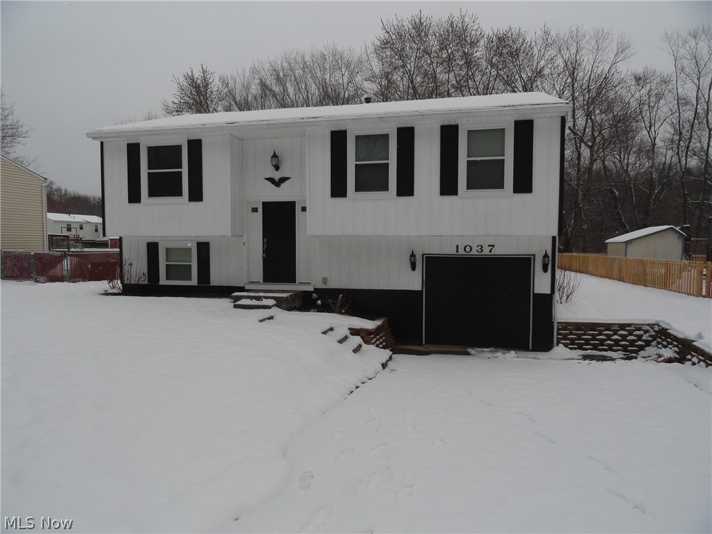 Move in ready, totally updated bi-level in Kent on a private road that dead-ends up to a park. The open floor plan is great for entertaining and holidays. Open dining room with sliders to back deck that overlook the fully fenced in wooded back yard. Sparkling kitchen with stainless steel appliances including wine chiller, new countertops, cabinets, and tile flooring. Completely updated full bathroom. All bedrooms have new carpet and fresh paint. Lower lever has new carpet, fresh paint, wainscoting, recessed lighting, and completely updated half bath. New flooring in living room and hall way. New furnace and a/c. Fresh paint throughout entire home. Partially covered deck. Attached garage.