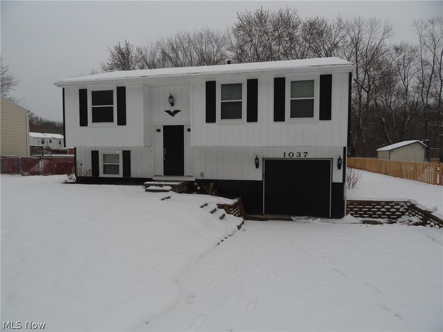Move in ready, totally updated bi-level in Kent on a private road that dead-ends up to a park. The open floor plan is great for entertaining and holidays. Open dining room with sliders to back deck that overlook the fully fenced in wooded back yard. Sparkling kitchen with stainless steel appliances including wine chiller, new countertops, cabinets, and tile flooring. Completely updated full bathroom. All bedrooms have new carpet and fresh paint. Lower lever has new carpet, fresh paint, wainscoting, recessed lighting, and completely updated half bath. New flooring in living room and hall way. New furnace and a/c. Fresh paint throughout entire home. Partially covered deck. Attached garage.