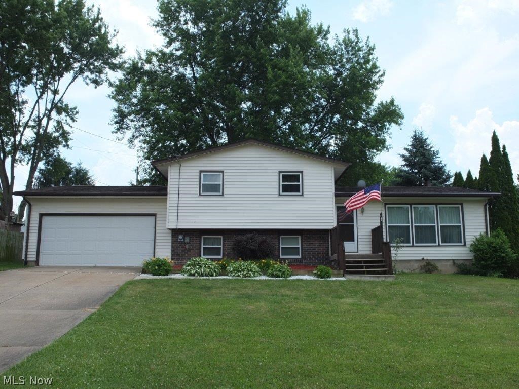 Well maintained 3 bedroom, 1 full bath 4 level split with fenced-in backyard and updated kitchen! Open first floor has newer carpet, a spacious living room, kitchen and dining room with French doors to back deck. Updated kitchen has new cabinets, countertops and appliances plus tons of counter space! There are 3 generously sized bedrooms and a full bath with new vanity top and tile flooring. Lower level has a family room with a wood burner with electric insert and a bonus room that could be used as an office or hobby room. Many updates including newer garage door opener, windows, waterproofed basement in 2003 and more! PLUS there are hardwood floors under the carpet on the 1st and 2nd floor. Fully fenced backyard offers a nice patio and a large deck great for entertaining! Come see all this home has to offer!