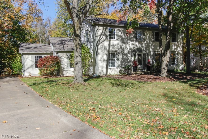 A fantastic opportunity awaits with this spacious Hudson colonial. Situated on a gorgeous wooded lot with park-like setting, this home is in a fantastic location close to schools, parks and downtown Hudson.  Very functional layout with open floor plan and neutral décor.  The first floor features a formal living and dining room as well as a family room with raised hearth gas fireplace, surrounding built-ins and bay window.  Beautiful refinished hard wood floors in much of the house. The spacious eat in kitchen opens to a large enclosed sun porch with gas line for potential year long enjoyment.  A half bath and laundry room complete the first floor.  The second floor features 4 very spacious bedrooms including the master with en suite bath as well as a 2nd full bath.  The full, unfinished basement provides great storage as does the over-sized 2-car garage.  A/C 2012, hot water tank ’13, disposal ’14. Tear off roof in 2001 with new insulation and vents in 2011.