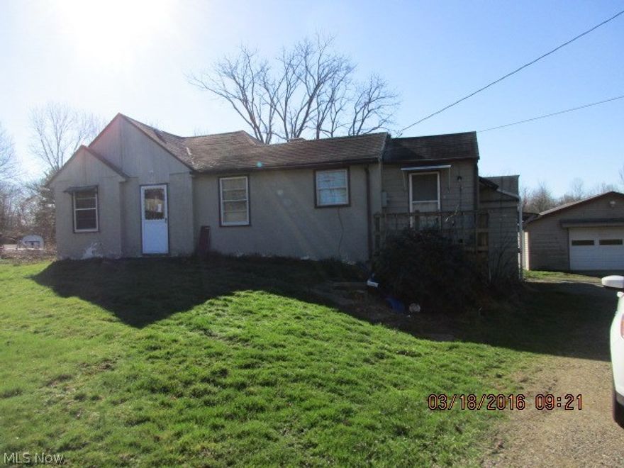 2 bedroom ranch on 1.37 acres with a newer 2 car garage in Northwest Schools.