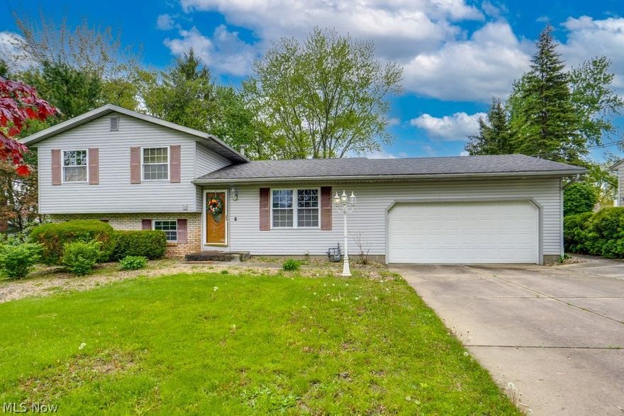 Move right into this spacious 4-bedroom, 2-bath home, featuring brand-new kitchen cabinets and countertops. Enjoy a bright, airy floor plan that leads out to a large deck and a private, screened gazebo.  The deep lot is adorned with beautiful mature trees for added privacy. Includes a shed with electric and a lower-level bedroom ready for your final finishing touches. This room is ideal as a home office, guest space, or storage. The hot water tank was replaced in 2023, the refrigerator in 2021, and the dishwasher in 2022.