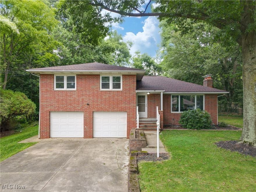 Beautifully updated home! So many endless possibilities!  The main level is open with a large living room with a wood burning fireplace. The kitchen is a chef's dream with tons of cabinets and counterspace and beautiful stainless-steel appliances. Upstairs you will find 3 large bedrooms and fully remodeled bathroom that has a tiled shower and double sinks. In the hall closet are washer and dryer hookups. Downstairs is a family room and the stairs leading down have built in storage.  Another full bathroom with a tiled shower completes the lower level. Step into the garage and find another doorway which leads down the partially finished basement which could be used as a guest suite or teen space. There is a wood burning fireplace, laundry space and a full bathroom down there which makes it ideal for all types of uses. Outside is a large deck that overlooks the private yard.  Two outbuildings are also available for storage. Set an appointment today!