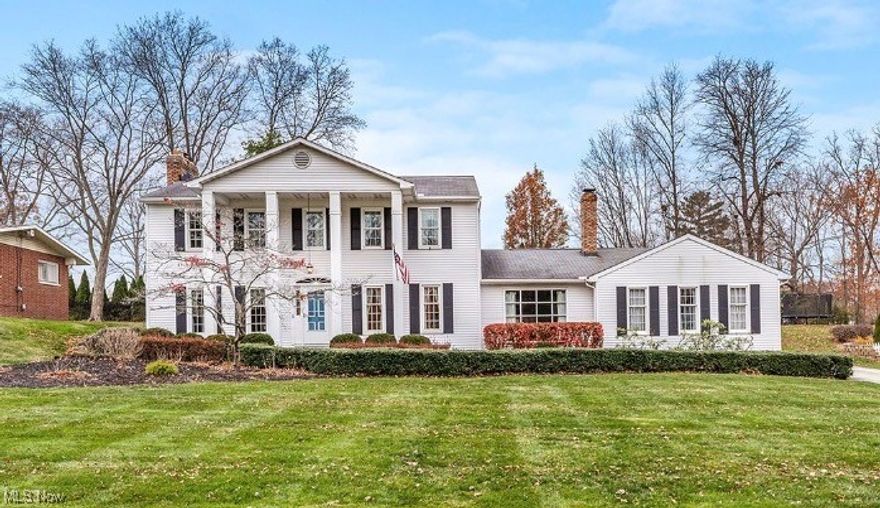 Welcome Home for the Holidays! Spacious and inviting 4 bedroom classic colonial available in a lovely tucked away neighborhood in Tallmadge.  The first floor offers a modern and convenient layout featuring a large living room with a fireplace, a spacious updated eat in kitchen with granite counters, a formal dining room, and a cozy family room with a wet bar and second fireplace.  Finishing off the first floor you'll also find a convenient half bath, a great drop zone/mud room off the attached garage and a wonderful 3 season room to enjoy the beautiful back yard.  Upstairs you'll find 4 generously sized bedrooms including a primary bedroom with en suite bath and down the hall is a lovely full guest bath.  The partially finished lower level offers plenty of options and boasts a 3rd full bathroom, as well as laundry and plenty of storage!  Beautifully landscaped exterior with mature trees and shrubs, a patio with a built in gas grill, a charming water feature and a massive rhododendron that is an absolute stunner in the spring. Dont miss this one!