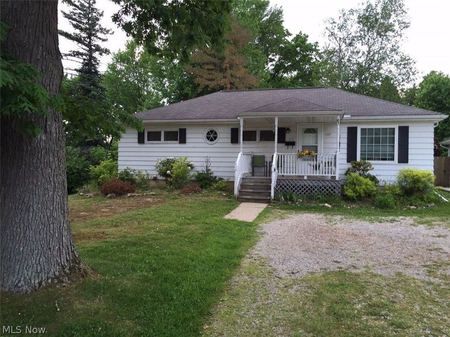 Cozy ranch with a full basement and a beautiful treed yard in Tallmadge.  3rd bedroom is currently being used as a den/office and has 2 closets and built-in storage. Large living room with one end used as a dining room. Kitchen with lots of storage shelves. Inviting front porch 11x6 and back porch 10x8 overlooking park like back yard with storage shed.