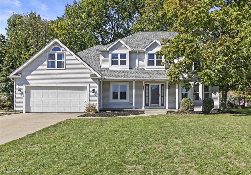 Welcome to 490 Vandalia Ave., located in the desirable Tallmadge Hills neighborhood. This spacious home offers 4 bedrooms, 4.5 baths, and nearly 3,000 sq ft of living space, plus an additional 828 sq ft of finished lower level. The open chef’s kitchen is a dream, featuring a Frigidaire Professional refrigerator/freezer, wall oven with microwave, abundant maple cabinetry, granite countertops, and a unique secondary prep area with dishwasher and extra sink. The adjoining dining area and large family room with gas fireplace flow seamlessly with ceramic tile flooring throughout. A stunning 24x16 great room with hardwood floors and wall-to-wall windows overlooks the private backyard with a gated inground pool, deck, and hot tub—perfect for entertaining.

The main level also offers an office/den, laundry room, and half bath. Upstairs you’ll find two primary suites, each with walk-in closets and full baths, plus two additional bedrooms and another full bath. The finished lower level includes a bonus/family room, craft room, two potential bedrooms, full bath, and generous storage space. Additional highlights include a whole-home generator, extra split HVAC system, and convenient second-floor laundry hook-up.

This rare find combines functionality, space, and outdoor living in one of Tallmadge’s most sought-after neighborhoods.