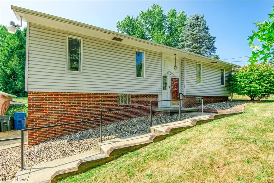 Welcome to 954 Alpine Blvd., nestled on .63 acres on a cul de sac within the Green LSD!  Upon entry, you have a large living area that connects to the spacious dining area and bright kitchen. All appliances convey. Just off the kitchen, there is access to a large, covered patio/outdoor space, which is the perfect spot for entertaining! Down the hall, you will find the 3 spacious bedrooms, one with private access to a half-bath. The lower level provides tons of storage with built-in cabinets, a shower room & a laundry area. Attached to this level is a 24 X 19 space once used as a workshop. The possibilities for this room are endless! The 4-car detached garage is a car lover, craft enthusiast, or gardener's dream! Updates include roof replacement on the house, garage & patio in (2020), water softener/conditioner, filter canister & pressure pump (2024), Hot water tank (2024), and door lock replacement (2024). This move-in ready home is waiting for your personal touch & décor ideas!