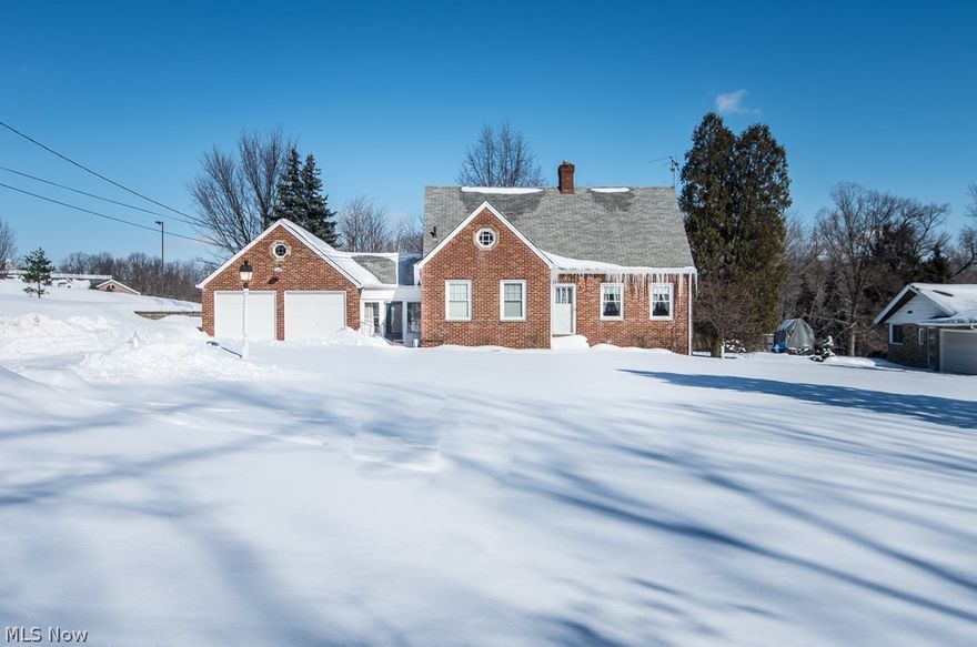Incredible one owner all brick home w/ loads of character and WOW, what beautiful natural woodwork! Features a 2.56 acre lot with scenic views! This home has been very well maintained and in some areas untouched since it was built! Knotty pine wood paneling in a very spacious living room w/ sandstone hearth wood burning fireplace and a duplicate one in the semi finished walk out basement. Very custom in design w/large picture window off the quaint formal dining room w/ built in corner china cabinet, newly remodeled efficient kitchen with Formica Maple-like cabinets and counters. All large bedrooms including the 2nd floor w/ naked wood floors and plaster walls including 1/2 bath and lots of storage. Large 2-car garage w/ loft and mechanics pit. Check out the pics, they don't lie!