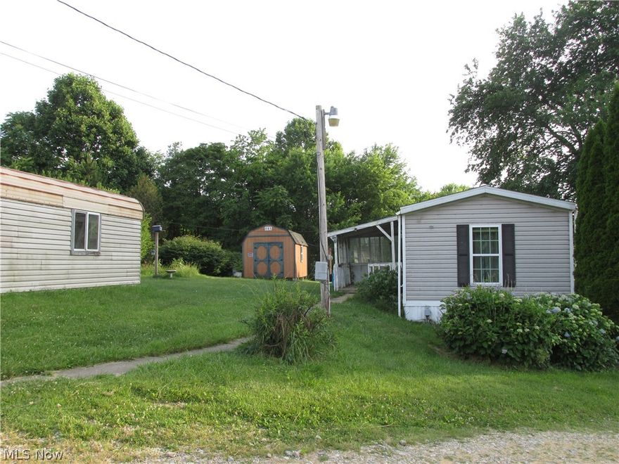 The property is 1.44 acres right outside of town, with a 14X65 2 bedroom, 2 full bath mobile home 20 plus yrs. old.  It has 3 storage buildings and a graveled covered carport area and a shared driveway.  It's all set up for someone to make it their own in a private location, with a price anyone can afford.