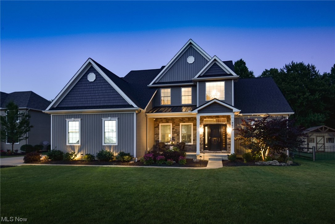 As you walk through the front door of this custom built Grand Oaks Colonial you’ll immediately feel at home! The upgrades throughout the building process along with the updates made since built are impeccable! With 5 bedrooms including a first floor master suite and 4 add'l bedrooms up with double jack and jill bathrooms...you’ll have all the space you need! There is a nice sized office complete with custom built wood furniture included. The master suite has a vaulted ceiling, private bath with custom tiled shower, dual vanities with cabinet storage and walk in closet. The spacious family room has a stylish, coffered ceiling and double sided stone fireplace that is shared by the covered porch. The gourmet kitchen is complete with wood cabinetry, quartz countertops, oversized island with seating for 5, stainless steel appliances and vented hood, tile backsplash, walk in pantry and is open to both the bright and airy morning room and family room. The mudroom is great for coats, bags and