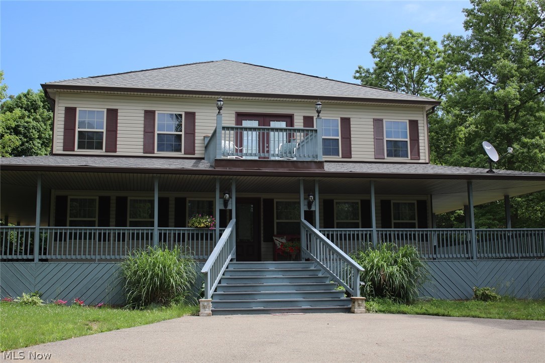Breathe easy here! There is plenty of room and space for all the essentials on this 10.706 acre tract. Orchard trees, flat space for a vegetable garden, wooded area to hunt and a spacious well-appointed 5-bedroom, 2-bath home to comfortably live. This Amish constructed home, built in 2015, features a 360 wrap around porch to view your serene surroundings. There is a unique first floor family area with a fireplace focal point. The kitchen has high end appliances and granite counter tops. This is country living, but you won't be roughing it. Two water wells provide a sure supply of water. Underground electric utility improves reliability and reduces maintenance cost. If there is an electrical outage a 35K Generac standby generator with an automatic transfer switch powers all the modern necessities of life without interruption. High speed internet is available to keep you in touch and entertained. There are multiple heating sources to stay warm. A propane forced-air furnace, with a buried tank to save you from having to look at it, along with a heat pump, a wood stove in the basement and an outdoor wood burner all to keep you comfortably warm. Zoned air conditioning keeps the downstairs and upstairs at the cooling level you select. A 3-car garage with tall doors allows for easy storage of your tall truck. All this and only minutes away from an 18-hole golf course and Ohio's largest state park, Salt Fork. Schedule your visit before its gone! Mineral rights are negotiable.