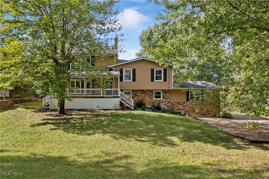 Step into this beautifully remodeled split-level home offering over 2,900 square feet of stylish and functional living space, perfect for today’s modern family. This spacious layout features 4 large bedrooms, a bonus den/office, 3 full updated bathrooms, and a convenient attached 2-car garage. Located near Route 43, ideally positioned between Kent and Streetsboro, you’ll enjoy close proximity to shopping, dining, and easy freeway access. The home’s curb appeal shines with a new paver walkway and refreshed front porch welcoming you inside. The main living room features recessed lighting, a ceiling fan, and flows seamlessly into the completely redesigned kitchen, showcasing granite countertops, tile backsplash, modern black hardware, stainless steel appliances, a sleek black faucet, ample cabinetry, breakfast bar with pendant lighting, and an eat-in nook with access to the sunroom. Retreat to the incredible primary suite with French door entry, vaulted ceilings, recessed lighting, ceiling fan, and a walk-in closet with custom built-ins. The luxury en suite bath offers dual sinks and a new walk-in shower. Three additional bedrooms and another full bathroom with dual sinks and a tub/shower combo complete the main level. The lower level includes a spacious family room, a full bath/laundry room, and a mudroom connecting to the oversized garage. The basement level adds a versatile office or den with its own walk-in closet, perfect for remote work or guest space. Enjoy the outdoors from the sunroom overlooking a large lot, complete with a multi-tiered deck and fire pit area, ideal for entertaining or relaxing evenings. Recent updates include new paint, LVP flooring, carpet, modern finishes, new furnace, new hot water heater, new water softener, and more! This home truly blends style, space, and function in an unbeatable location, move right in and enjoy!