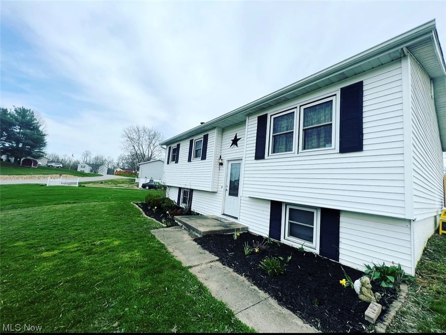 This lovely 4 bedroom 1 bath home sits near the end of the Pikeview cul-de-sac. Located in East Muskingum School District, yet just minutes from Cambridge and New Concord. Sliding glass doors off kitchen to deck and fenced backyard. 3 bedrooms on main floor with full bath.  Basement is partially finished and offers additional living room space with gorgeous stone fireplace. 4th bedroom located in basement could also be used as office or playroom.