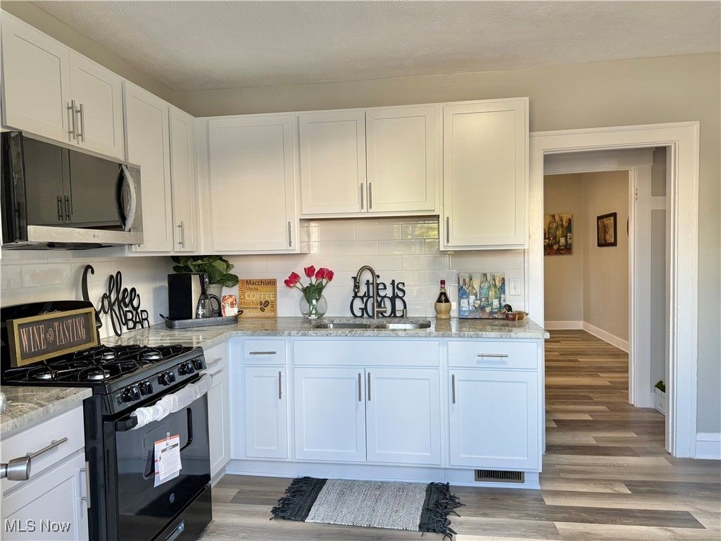 Photo of 11002 Parkhurst Drive, Cleveland, OH 44111 (MLS # 5161811)