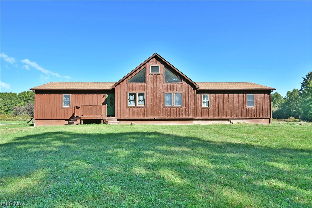 With 20 available acres and an absolute-must-see great room, this Southington ranch will have you quickly falling in love! Set far off the road and surrounded by scenic, rural views the wood sided home packs instant curb appeal with its A-frame styled pent center and window lined walls. A two-car garage extends around the far corner while a concrete walkway leads up to the raised front deck. Inside, a handsome foyer draws you closet with its dark, hardwood styled flooring and sliding barn door to hide first floor laundry access. To your left, the master bedroom suite branches away with carpeted flooring, oversized walk-in closet and full private bath. Meanwhile, the central great room steals the show with its towering, exposed truss work and two tiers of natural light that spill down to illuminate the living space below. Let the impressive kitchen take your breath away with its impressive center island, doubling for bar top seating with its epoxy countertops. Formal dining looks on nearby along with casual office space. Down the far side hall, a trio of spacious guest bedrooms brings the total to four as a second full bath and home office completes the package. The extra large 2 car garage has an additional entrance to the full basement (2288 sq ft) that is partially studded for additional living space and bath. There is soo much potential here. Home warranty is included by the seller.