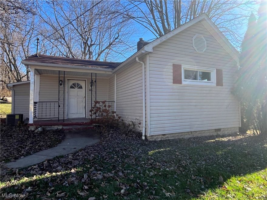Updated Ranch home in town with a country feeling back yard! Public utilities, home features two bedrooms, eat-in kitchen adjoining dining room, first floor laundry, covered front porch, one car detached garage. Ready to move into!