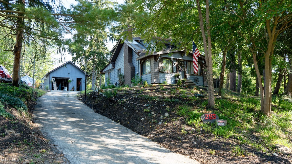 A Nature Lover’s Retreat Just Minutes from Town. Nestled in a rare and serene setting, this property offers the perfect blend of convenience and tranquility tucked between the energy of the city and the charm of nearby neighborhoods, yet surrounded by lush, protected forest. Enter your own private oasis, where an empty lot next door and woods behind provide unmatched peace and privacy. In the backyard, you’ll find a pond that draws deer, hawks, and colorful songbirds, along with towering trees that create a perfect spot for a hammock. It’s easy to forget you’re so close to town when you’re relaxing in this rustic, cabin-like atmosphere. The cozy two-bedroom bungalow sits on OVER an acre, offering both charm and potential. The upstairs features two bright bedrooms with a shared closet, a full bath with a shower and built-in jet tub, and plenty of natural light. The main level has a brand-new kitchen with updated cabinets, a refrigerator, and a stove, plus a nearly finished second full bath. The home also boasts a new furnace, with the option to add central air later. An enclosed front porch with two unfinished bonus rooms, new fencing and freshly painted flower beds in front and back. Opportunities like this where you can have nature, space, and convenience don’t come around often. Come see the potential for yourself, and imagine the life and memories you can create here.