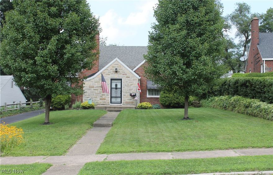 This charming brick bungalow is located on the cusp of Historic Ridgewood offering almost 2000 SF. Beautiful, spacious living room with gas fireplace, eat-in kitchen with oak cabinets and a formal dining room, and full bathroom. The first floor master bedroom features a bonus room providing endless possibilities. The second floor offers two bedrooms. each with deep double closets, a large full bathroom, and a hallway cedar-lined closet. The basement is ready to finish, some glass block windows, a stove and refrigerator. A screened-in sun room off the kitchen is perfect for relaxing and entertaining in the lovely backyard. Two car garage with opener and an additional side parking space. vinyl windows, central air. Must see to appreciate.
