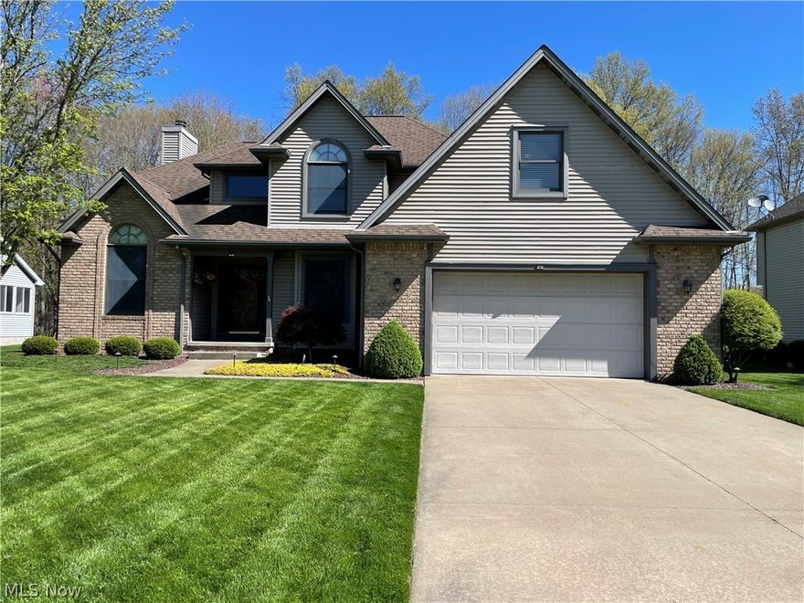 Stunning 4 bedroom home within walking distance to Firestone Park! Featuring a two story foyer area, formal dining room, office, and open concept living room/kitchen area as well as  first floor laundry and a half bath. The home has been freshly painted, with new carpet installed on the first floor, new Dolomite kitchen countertop, tile backsplash and newer stainless steel appliances. This home is truly turn-key ready. The second floor features a master suite with large walk in closet and master bath. Three additional bedrooms, a media room and full bath complete the second floor. Enjoy cozying up in the living room next to the gas log fireplace with brick surround. Or enjoy these beautiful Spring evenings on the brick patio overlooking the back yard. The patio has plumbing to hook up your gas grill to the homes natural gas, never worry about running out while you are grilling out! The large two car garage is fully finished and heated. The 12 course block basement is plumbed for a bath