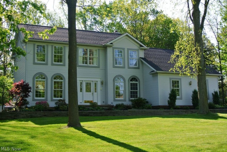 Beautiful woodwork thru out.  Crown Moldings thru out first floor.  Wainscot in foyer, dining rm, office and hallways.  9 ft ceiling on the 1st flr. Maple Hardwood Floors in Foyer, office, half bath, kitchen and dinette area.  1st floor office with French dr, crown molding, wainscot, arch windows, build in shelves and work station. Gorgeous newer Kraftmaid white maple cabinets, soft close drs and drawers, pull out trays, crown moldings, under cabinet lights, light rails, upgraded granite tops, glass back splash,  island, stainless steel appliances, recess lights & beautiful light fixtures.  Formal Dining Room with crown molding, wainscot & arch windows. Great rm with vaulted ceiling, gas fireplace and sky lights.  Master bath with Jacuzzi and cherry vanity.   Partial finished basement with full bath rough in.   2 1/2 cars side entry garage. Large deck and Shed.  Roof 2009, furnace & A/C 2010, kitchen and appliances 2011, gutter and leaf guard 2011.  Close to freeways and shops.