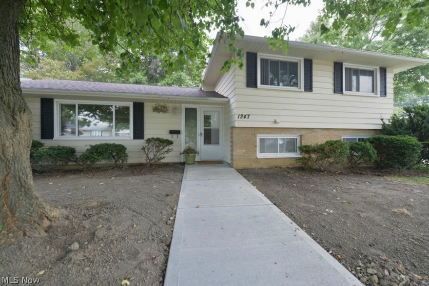 Inviting home with many recent updates! Eat-in kitchen features new cabinets in July '14, stainless steel appliances and ceramic tile backsplash. Spacious living room leads into formal dining room. Large master bedroom and 2 additional spacious bedrooms. Bonus room in lower level could be used as an office. Entertain on the huge patio in the fenced-in and private backyard. Hardwood floors throughout. New in July '14: roof with complete tear off, sewer line from house to street and paved walkway to front door. Vinyl replacement windows, new furnace in 2013, also has newer hot water tank. Washer and dryer included. Mudroom from garage to house. Additional shower on lower level. Conveniently located with easy access to I-271 and shopping on Mayfield Road.