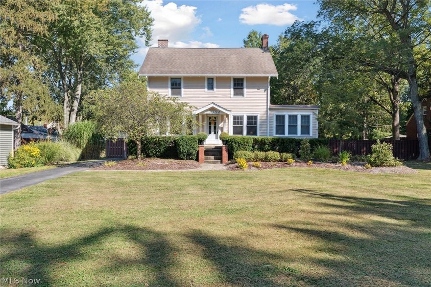 Welcome back to 23052 Mastick Rd in North Olmsted—an inviting modern farmhouse blending timeless character with thoughtful updates and ready for its next owner. Situated on 1.5 acres this 3-bedroom, 2-bath home offers charm, natural light, and beautifully connected living spaces. The spacious open kitchen features crisp white cabinetry, granite countertops, stainless steel appliances, and abundant cabinet and counter space. Brick accents and open shelving add warmth, while sliding doors lead to a bright three-seasons room overlooking the expansive backyard. The main level flows into the living room with built-ins, a painted brick fireplace, and refinished hardwood floors that continue into the sun-filled family room wrapped in windows. Upstairs are three bedrooms with refreshed hardwood floors, an updated full bath with double sinks, and convenient second-floor laundry. A walk-up attic provides excellent storage, and the finished basement with a second full bath offers flexible space for guests, recreation, or a home office. Recent improvements include a new refrigerator, stove, washer, dryer, and many additional updates within the last six years. Outside, enjoy a park-like yard featuring two fully fenced areas—ideal for dogs—plus an additional unfenced rear portion that offers privacy and endless possibilities for future use. The property also includes a paver patio, 2-car garage, and a heated barn. Located across from the Metroparks and minutes from highways, shopping, dining, downtown, and schools, this property offers peaceful surroundings with everyday convenience. Schedule your showing today!