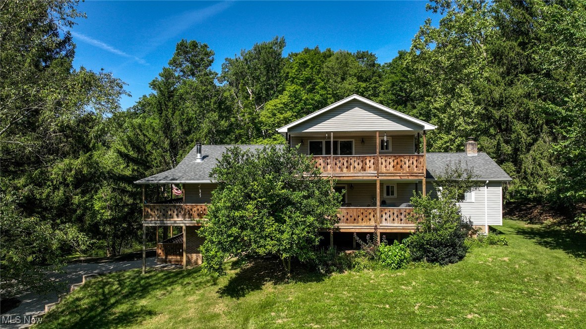 Welcome to this one-of-a-kind home 5 bedroom home located on a private, peaceful, park-like 2+ acres in the top-ranked Highland School District. Beautiful luxury engineered vinyl hardwood look and quality carpeting throughout. The main living spaces create a classic and cozy feel the moment you walk in. Some of the home’s standout features include its flexible layout, including two great room areas, a spacious kitchen, both a lower level and second floor laundry room and expansive decking around the entire home to take advantage of the beautiful long views! Whether you are looking for your own quiet paradise, hosting visitors or looking for multi-generational living options, this versatile home adds incredible value and functionality. And there is more! For your home occupation, hobby or collecting – a huge commercial-grade built outbuilding! Pond side is ideal for summer barbecues or simply enjoying peaceful afternoons in your own oasis. Whether you’re entertaining or relaxing, this outdoor space offers the perfect backdrop. Country living conveniently located to both Cleveland and Akron, this one-owner home is ready to welcome it’s next chapter.