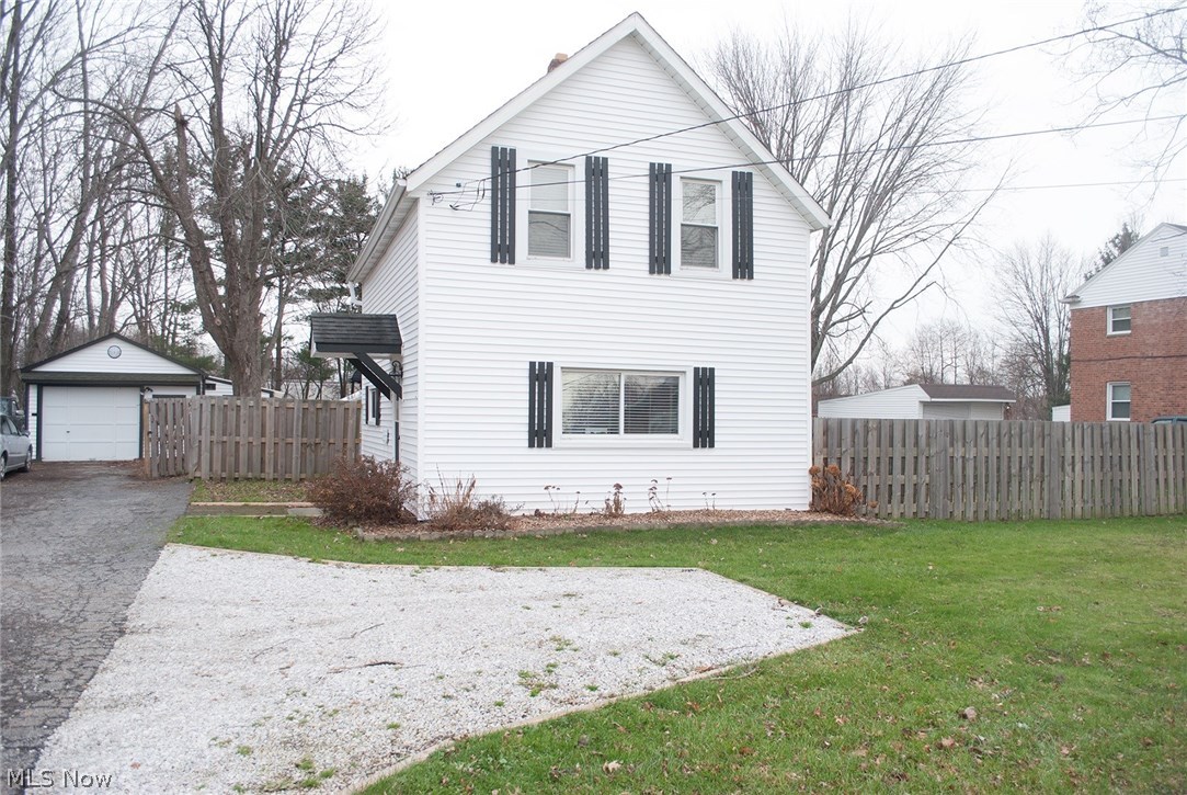 Become a part of the Sustainability Movement! This is a rare opportunity to own your own urban farm. This cozy bungalow is situated on 1/2+ acre of growing space. With green house, chicken coop, bunny hutch, raised beds, established perennial crops, and more, you'll have a head start on establishing your own personal food source w/ surplus to share! This three bedroom, two full bath home is warm and welcoming from the moment you enter. Pride of ownership shows here as the sellers have worked over the years to restore the charm of this old quarry worker's home, while cultivating the lot on which it sits. Enjoy special touches like hand painted cabinets, reclaimed Tremont French doors, and a first floor bedroom / office / classroom. Features like a brand new second full bath on the second floor and the first floor laundry add convenience. Located in a sleepy little rail and college town, you will love our parks, lakes, community centers, fairgrounds, Browns training camp, and community e