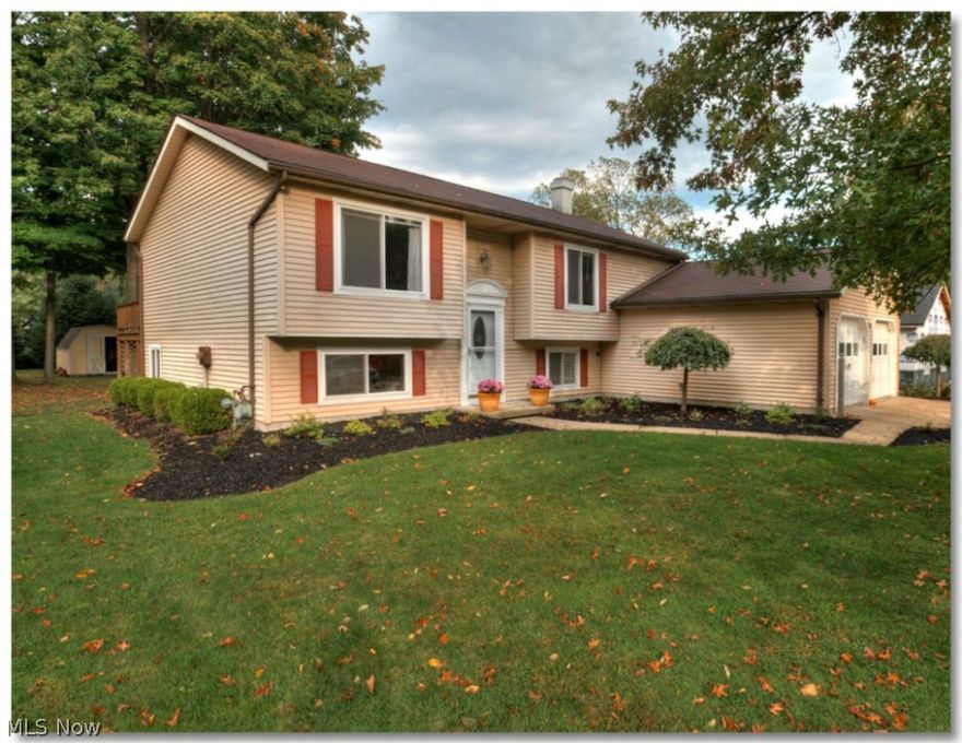 MUST SEE HOME!!! This spectacular Bi-Level located in Painesville Township is just what you have been waiting for. Just unpack and enjoy all this home has to offer. The main level offers a spacious living room, dining room and kitchen. There are also two large bedrooms and a full bath as well. Enjoy the park like setting while sitting on the deck overlooking the treed yard and storage shed. The lower level has a large L shaped family room with fireplace, the third bedroom and a full bath. The home has been tastefully updated and painted and is ready for you. Please make an appointment to see this beautiful home today!!!