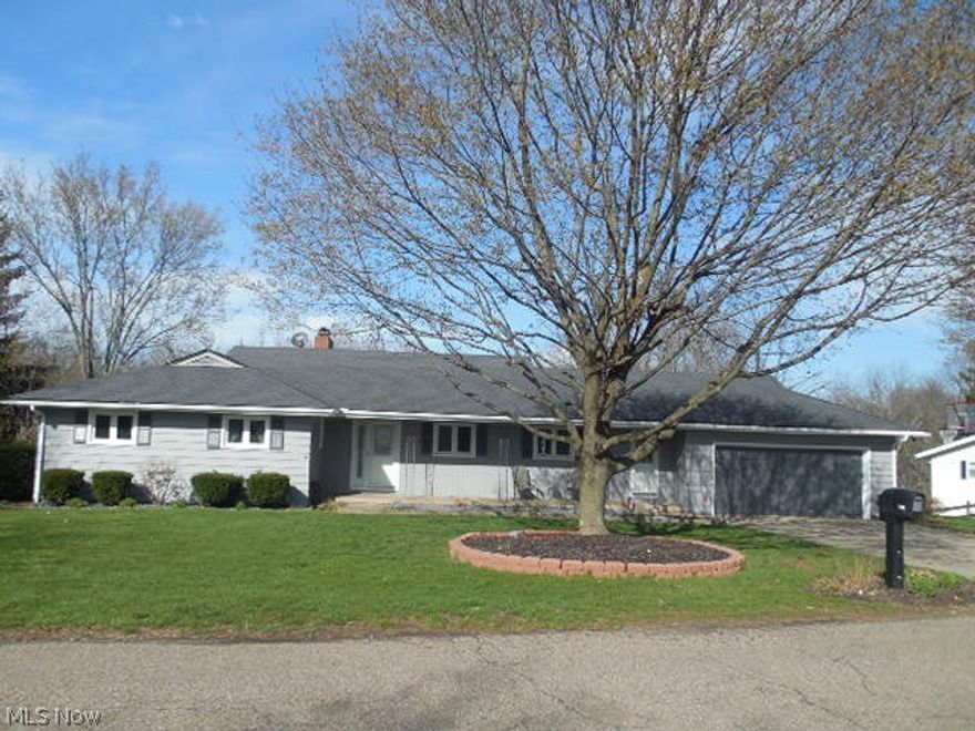 This is a beautiful updated ranch style home in a scenic neighborhood close to the school complex. The home has 4 bedrooms with 3 full bathrooms. The sellers have done many updates including floors, bathrooms and newly painted outside. From the front of the home you enter into a nice sized foyer which has solid mahogany woodwork, from the foyer you can either enter into the kitchen or down hallway to bedrooms or continue into the very spacious living room which also has the solid mahogany woodwork with wood burning fireplace. You then enter into the open formal dining room, from the dining room down a short hallway is a very large eat in kitchen with stainless steel appliances. From the kitchen you can go down the hallway to the 3 bedrooms. There is a full bathroom out in the hall for the too smaller bedrooms. In the master bedroom is a completely renovated full bathroom. Off of the kitchen is a mud/ laundry room that has an access door to the front of the house or into the 21 x 23 att