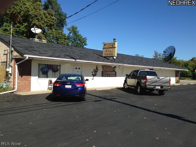 6054 sqft building and .89 acres of property. The building is well maintained and has many updates. The property has two addresses with separate entrances for renting out or can operate multiple businesses. 4 bathrooms total. Separate office bathroom. Separate meters utilities for both addresses for gas and electric. Movable partition inside. Approximately 80-car, paved parking lot. Could be used for almost anything, office space, medical offices, winery, restaurant, retail, antique store, arcade, etc. The possibilities are endless. Grandfathered for General Business 1. Currently used as a restaurant/tavern. There is a working kitchen, stainless equipment, freezer, inventory and lots of storage. Has an Outdoor patio with privacy fence. Newer roof and central air conditioning unit, and many other improvements. Conveniently located between Rt 58 and Rt 60 and only minutes from I-90 and the Ohio Turnpike. Currently a well established local Tavern with two fully functional b