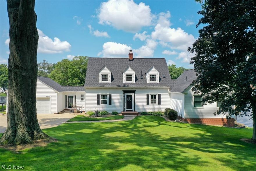 Come see this beautiful lake front home on Portage Lakes. It is on a large lot, especially large for the "Lakes". The upper and lower decks both have their own "Look at the lake" and are perfect for entertaining or serenity! A 27 hole Turkeyfoot Golf Course is directly across the street (It is 4 star rated). The house has many extensive updates. New roof and gutters in 2020 and new windows and doors in 2018. There are fireplaces in the great room and lower family room. Both heat and glo and can be used as a secondary heat source. The family room on the lower level (man cave) is totally redone with luxury vinyl floors, new ceiling, and walk out sliders to private patio. Half bath off of the kitchen has been totally updated in 2021, The master bath has all new amenities. Floating vanity, marble floors, marble walls, and shower with multi-head shower system. Come see this one it will go quickly!