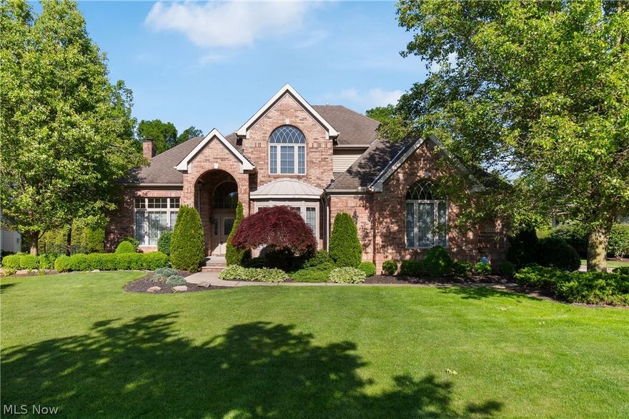 Welcome to this stunning brick-front Colonial nestled in the highly sought-after Courtland Meadows community of Westlake. Offering over 3,700 square feet of finished living space, this elegant 4-bedroom, 5-bath home pairs timeless architecture with spacious, light-filled interiors designed for both everyday living and entertaining. The dramatic two-story foyer opens to soaring ceilings, refined formal living and dining spaces, and an impressive family room with custom built-ins, a wall of windows and a gas fireplace. The spacious eat-in kitchen features stone countertops, a center island, breakfast bar, and abundant cabinetry. A first-floor owner’s suite provides a private retreat with tray ceilings, a spa-like bath, soaking tub, granite vanities, and walk-in closet. Upstairs, generously sized bedrooms and additional baths offer comfort and flexibility for family or guests. The finished lower level expands the living space with a large recreation area with built-in cabinetry, an additional half bath plus a bonus room...perfect for entertaining, a home gym, or media space. Outside, enjoy a beautifully landscaped yard and a private patio ideal for relaxing summer evenings. Located on a quiet cul-de-sac near Crocker Park, parks, dining, and top-rated Westlake schools, this exceptional home offers luxury, comfort, and an unbeatable location.