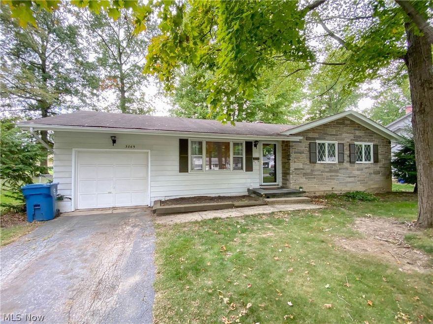 Adorable 3 bedroom Austintown ranch home features a spacious family room with Large Windows offering plenty of natural sunlight, Fabulous kitchen with tons of storage and counter space and newer tile backsplash and open floorplan through the dining room. Hardwood floors throughout and updated full bath. The finished lower level recreation room offers additional space for entertaining, Second Bathroom located in the unfiished portion of the basement along with laundry area.  Attached single car garage and man door leading to the backyard. All situated on a mature, landscaped lot conveniently located near local restaurants, shops and area highways. Take the opportunity to make this your new Home Sweet Home, Schedule your private showing today!