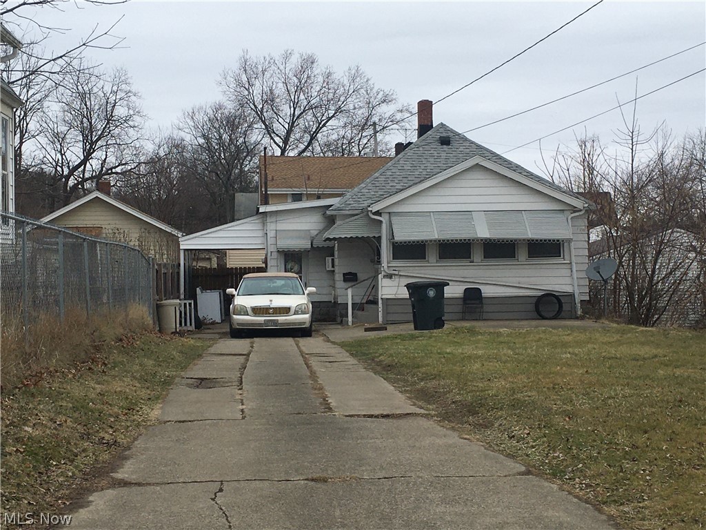 Quaint two bedroom home currently investment property. Large front yard, with view of lake, enclosed front porch, small home, breezeway, and attached garage. Seller would prefer to sell with the investment portfolio. Home has newer hot water tank and serviced AC. Long term tenant in place. The package includes 6 SFR on Thelma Ave, SFR on Manchester Rd, an a duplex on Harrison. MLS numbers are 4166165, 416557, 4165570, 4165565, 4165420, 4166154, 4166147, 4166562. Contact listing agent for more details.