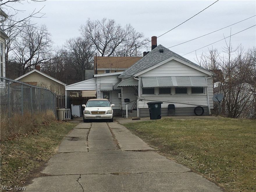 Quaint two bedroom home currently investment property. Large front yard, with view of lake, enclosed front porch, small home, breezeway, and attached garage. Seller would prefer to sell with the investment portfolio. Home has newer hot water tank and serviced AC. Long term tenant in place. The package includes 6 SFR on Thelma Ave, SFR on Manchester Rd, an a duplex on Harrison. MLS numbers are 4166165, 416557, 4165570, 4165565, 4165420, 4166154, 4166147, 4166562. Contact listing agent for more details.