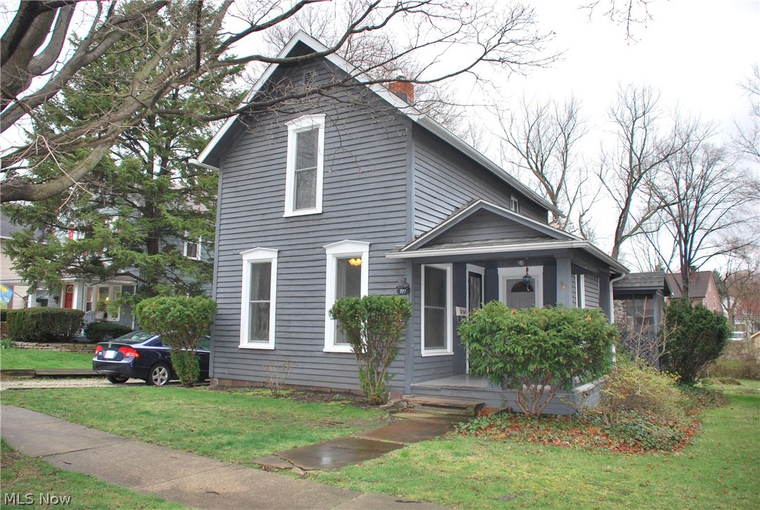 Wonderful quaint home in the historical district of Kent Ohio within a block of the KSU bus route for easy transportation! This home is clean and move in ready with an awesome back yard, deck & enclosed porch! Has a large Living Room with its own door to the front porch as well as a very large separate Dining Room also with a door to the front porch! The large original wood flooring is exposed & adds an awesome feel to this nice home! The kitchen looks over the huge back yard that is lush & ready for your garden! There is a 1st floor room currently used as an office that has been previously used as a bedroom which is off the main dining room. The upstairs has 3 bedrooms all with walk-in closets, the master bedroom is towards the front with 2 smaller bedrooms in the middle & back so looking out the side of the home and over the back yard. The basement has had the foundation partially replaced and fully repaired so it is dry & newer concrete! Newer updated furnace and water tank in one r