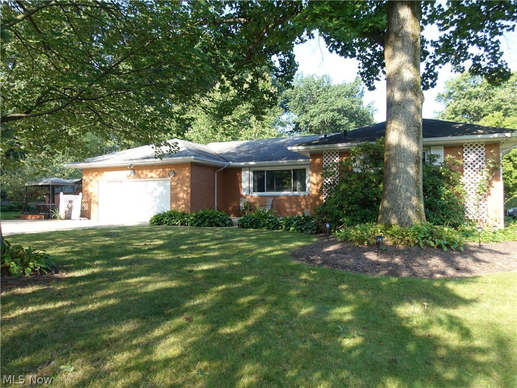 Spacious all brick ranch in Tallmadge! Lovely property features spacious living room with gas fireplace, crown molding & recessed lighting. The dining room also has crown molding and is open to the living room so it is perfect for entertaining. All bedrooms have hardwood flooring and nice closet space. The master offers an updated full bath with walk in shower (2016). A second full bath features double vanity and jetted tub. The applianced kitchen provides for plenty of cabinet and counter space, recessed lighting & has a pantry with pull out drawers. There's a nice sunroom with lots of windows for natural light and access to the side patio and beautiful yard. The lower level is amazing and offers a recreation room, separate room perfect for an office/bonus room plus a full bath with walk in shower AND has glass block windows. You will love the outside to relax by the fire pit, and side patio. Some updates include: Furnace/AC - 2014; windows - 2006; roof - 2001 (35 yr shingl