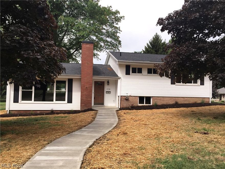 Great North Dover location! This totally remodeled house shows just like a brand new home! There are 3 bedrooms, 2 1/2 baths and an oversized 2 car attached garage. There is a brand new kitchen which includes a dishwasher and microwave. All new windows and doors throughout! There is also all new plumbing, electric, flooring, paint and 2 brand new bathrooms. The basement has been waterproofed and is finished with a fireplace. The living room is bright and airy with an open concept design and also has a fireplace for your enjoyment. There are patio doors off the dining room out to a large back deck. All new cement sidewalks and a new cement driveway. This home sits on a nice 99x136 corner lot close to the park! Move in ready condition!