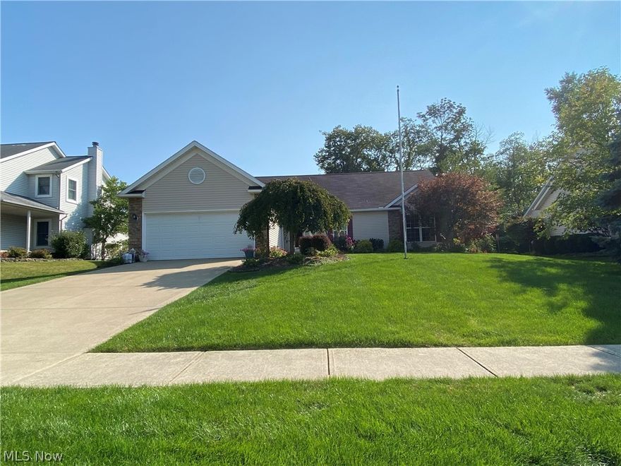 Welcome to the charmed life! Updated kitchen and baths in this spacious ranch. New granite counters, new tile floors, and new recessed lights. The layout is an open floor plan with laundry on main floor for easy one-floor living. The dream kitchen has huge stone counters. Kitchen connects with the family room and a breakfast room. From the sink is a view to the trees in the backyard. Large master bedroom suite includes a whirlpool bath, separated shower, and walk-in closet. Two more bedrooms offer endless opportunities for personalizing how you use this home. The huge basement includes a full bathroom. Natural light everywhere in this move-in ready property. The back patio is an oasis for grilling, yoga, or potted plants. Catch the morning sun on the patio and gorgeous sunsets from the dining room! The garden yields abundant flowers and vegetables. For a peaceful evening or a playful night filled with games and guests, this home can do it all. Convenient two-car garage. Neighborhood is